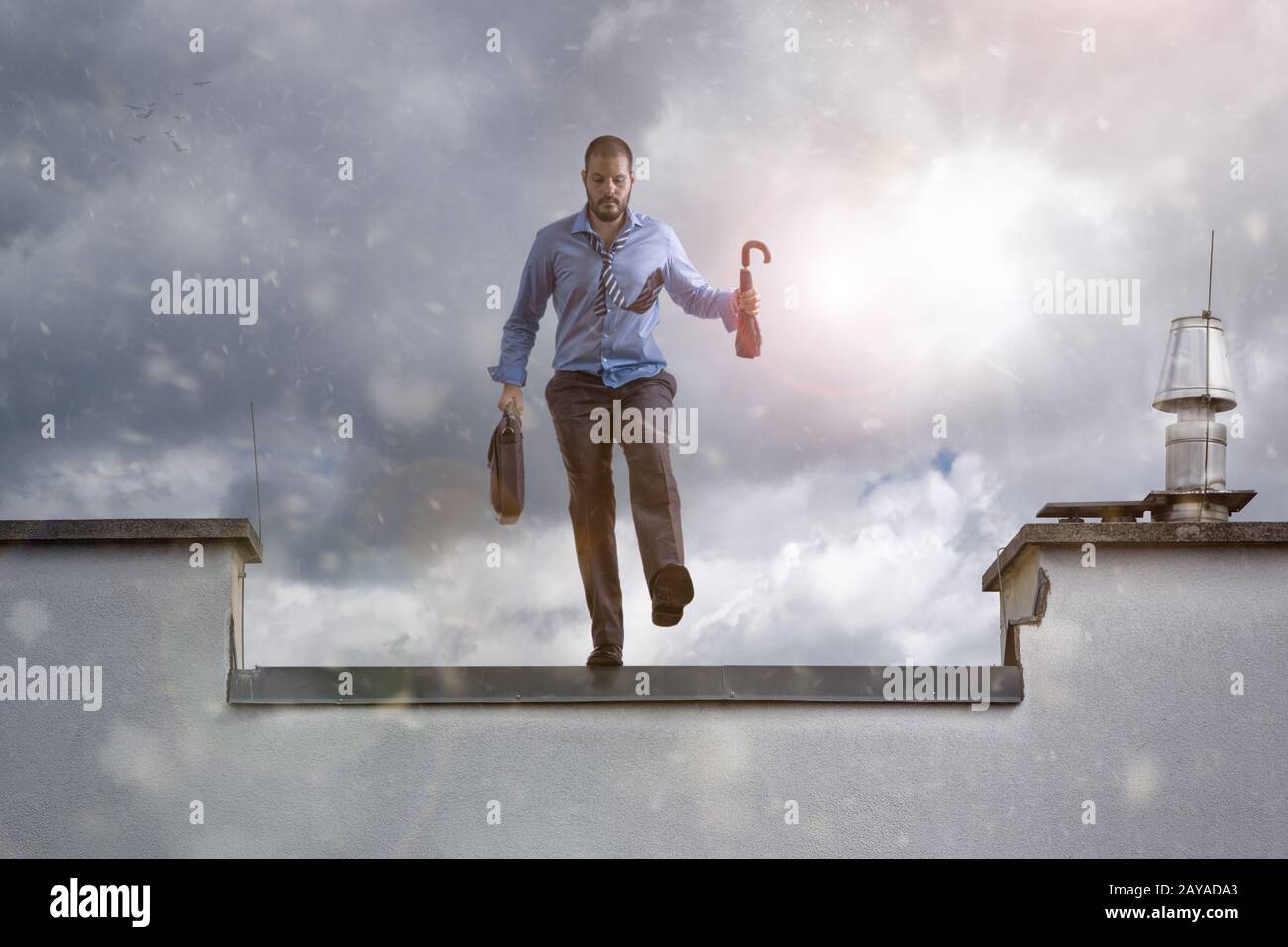 Businessman jumping from a skyscrapper and committing suicide. Business failure concept. Stock Photo