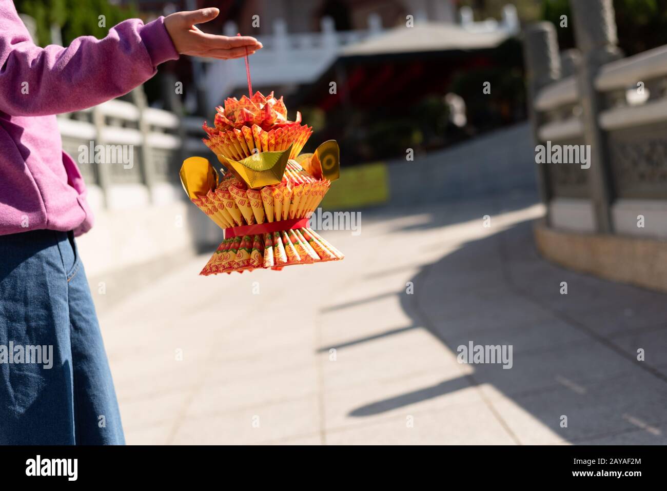 woman hold a lotus made by joss paper Stock Photo Alamy