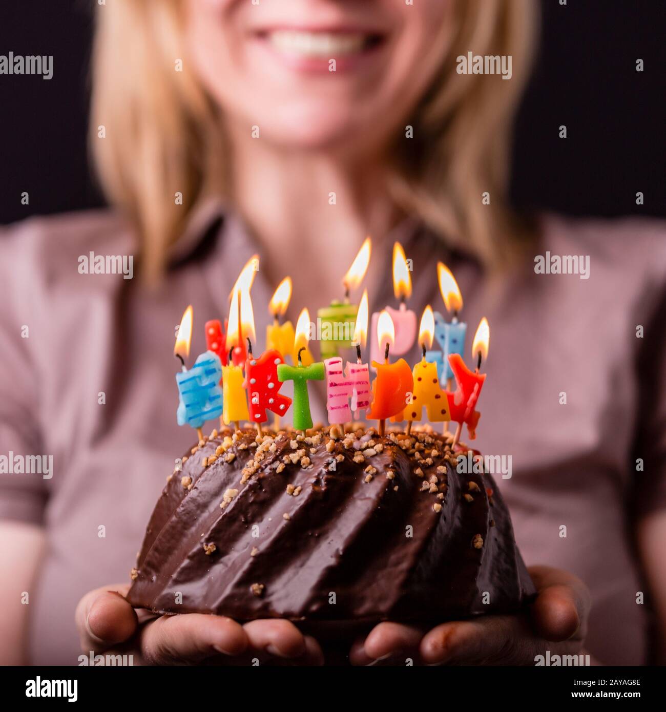 Candles on a birthday cake Stock Photo Alamy