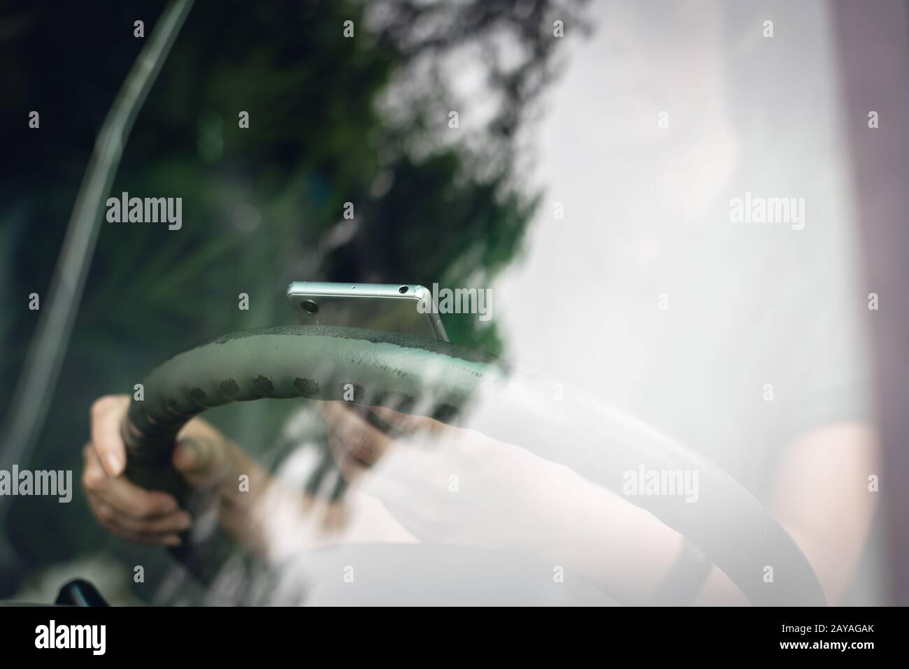woman using smartphone in a car Stock Photo