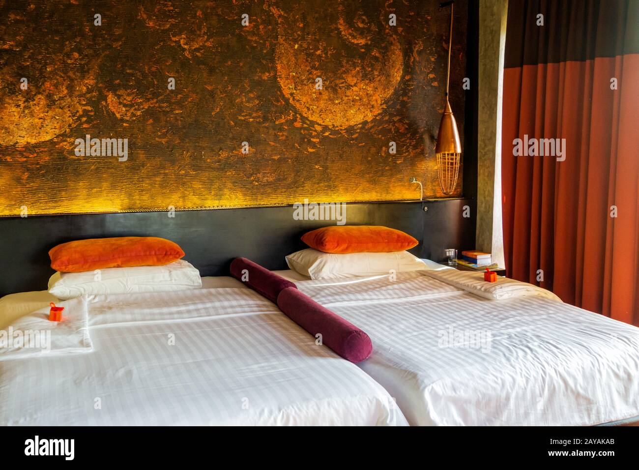 Large king size bed in decorative moody room Stock Photo Alamy