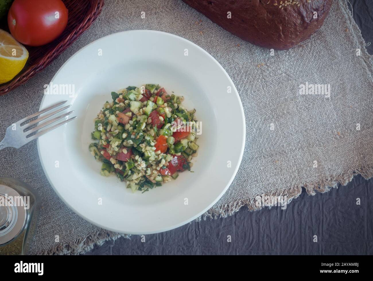 Arabic cuisine: popular vegetable salad with bulgur cereals. Stock Photo