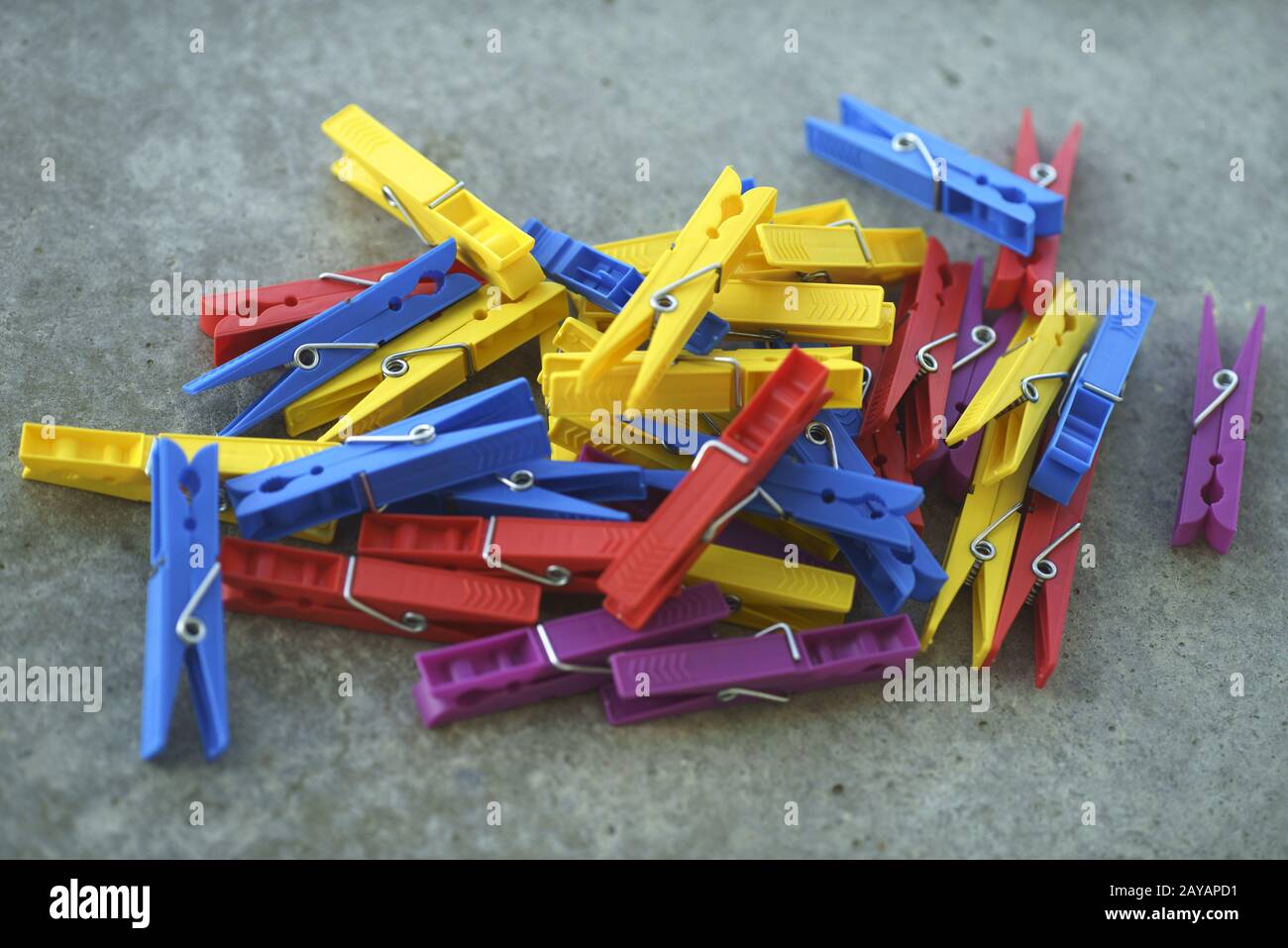 Colorful Plastic Clothespins Scattered Stock Photo