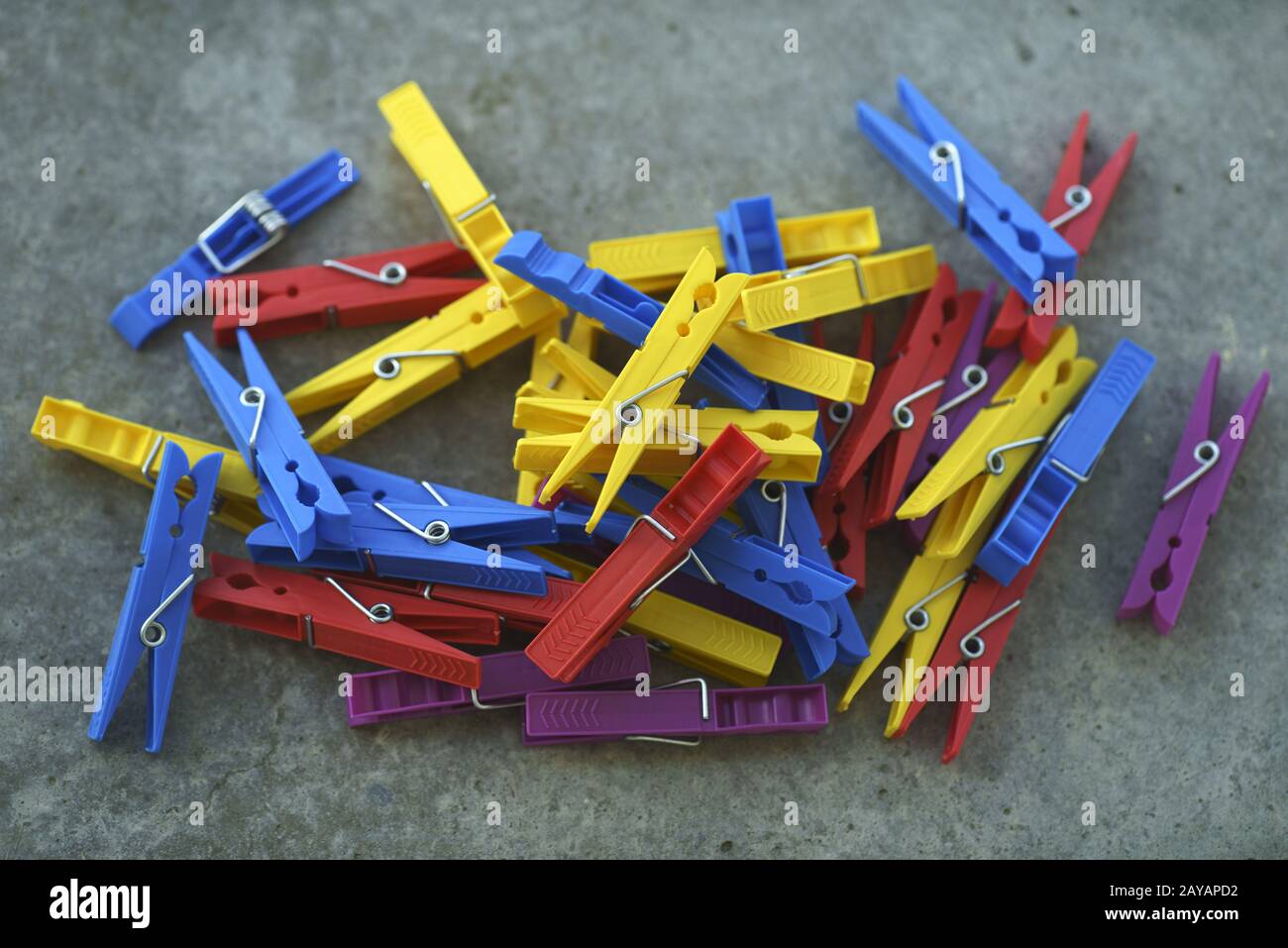 Colorful Plastic Clothespins Scattered Stock Photo
