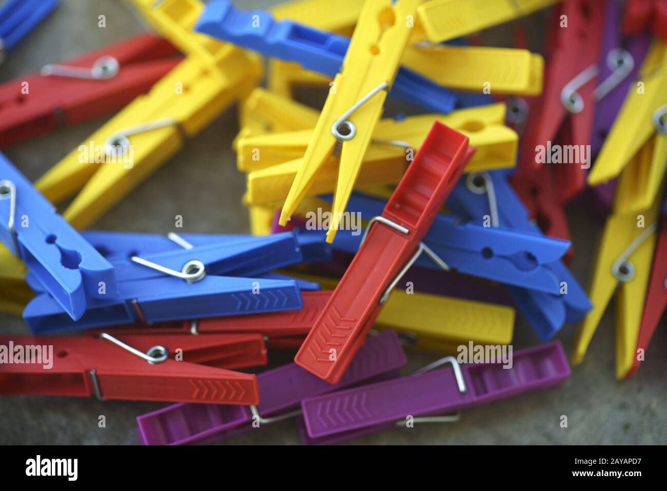Colorful Plastic Clothespins Scattered Stock Photo