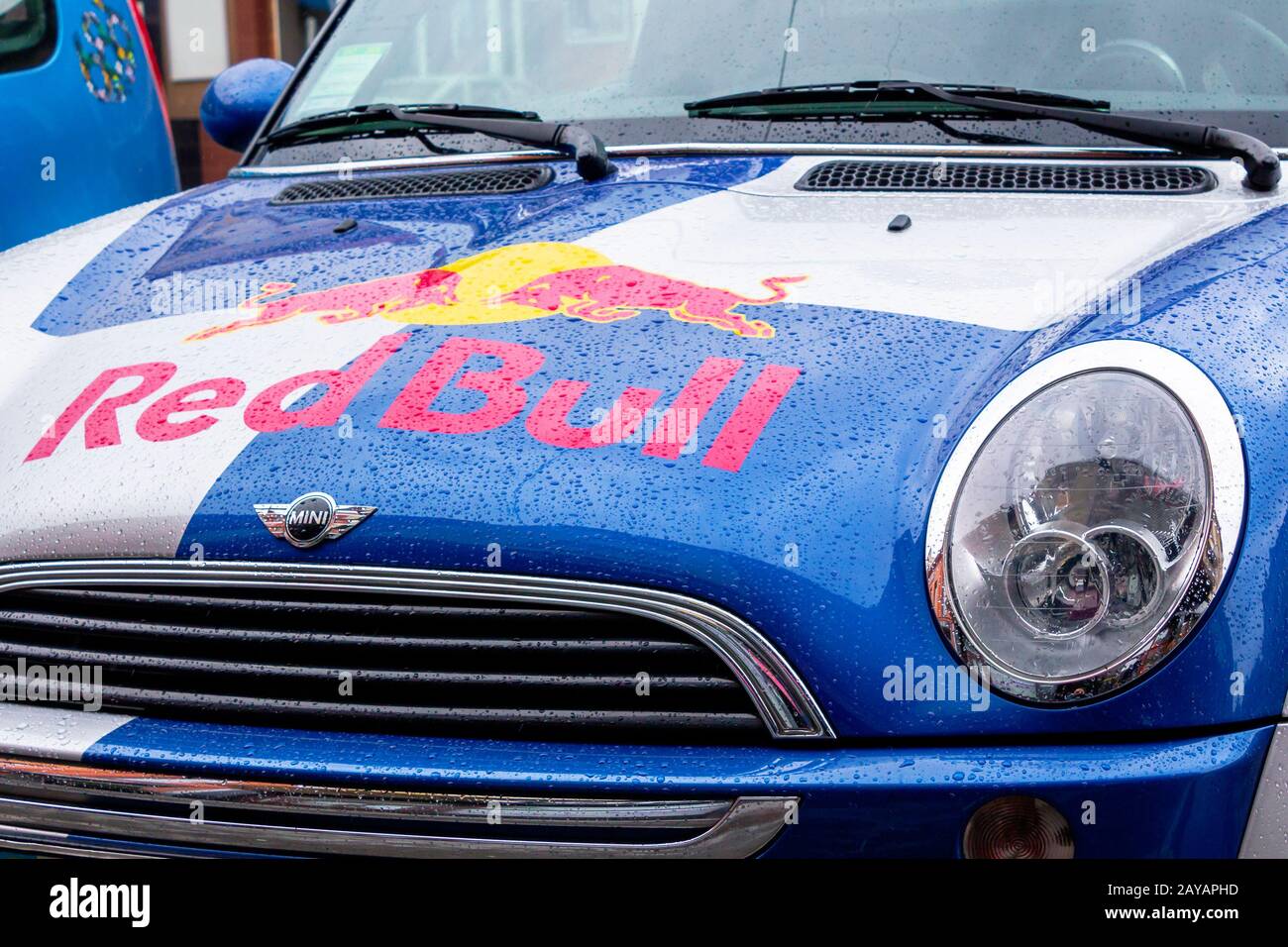 Uzhhorod, ukraine - 14 JUL, 2013: Red Bull mini cooper publicity car detail. fancy car tuning used for promotion. wet advertisement vehicle after the Stock Photo