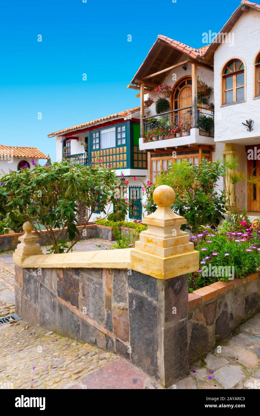 Tenza Colombia colonial houses with gardens with sun Stock Photo