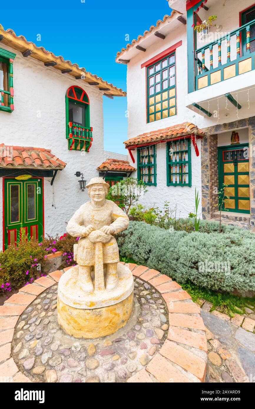 Colonial house garden with statue Stock Photo