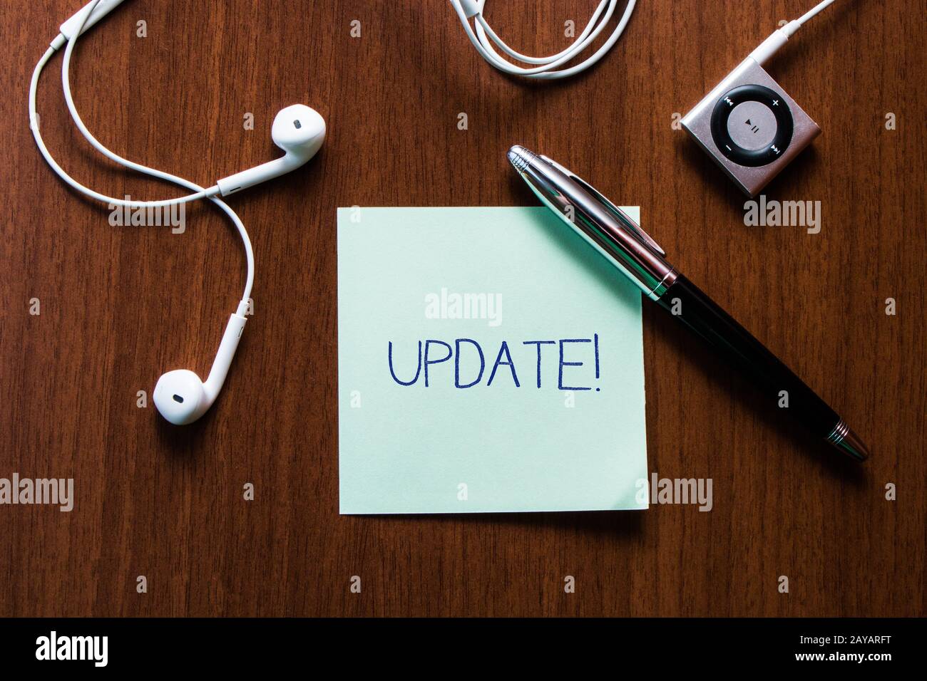 Handwriting text writing UPDATE. Concept meaning make something more modern or up to date like software program Upper view earph Stock Photo
