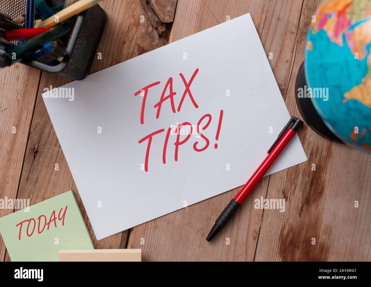 Word writing text Tax Tips. Business concept for compulsory contribution to state revenue levied by government Writing equipment Stock Photo