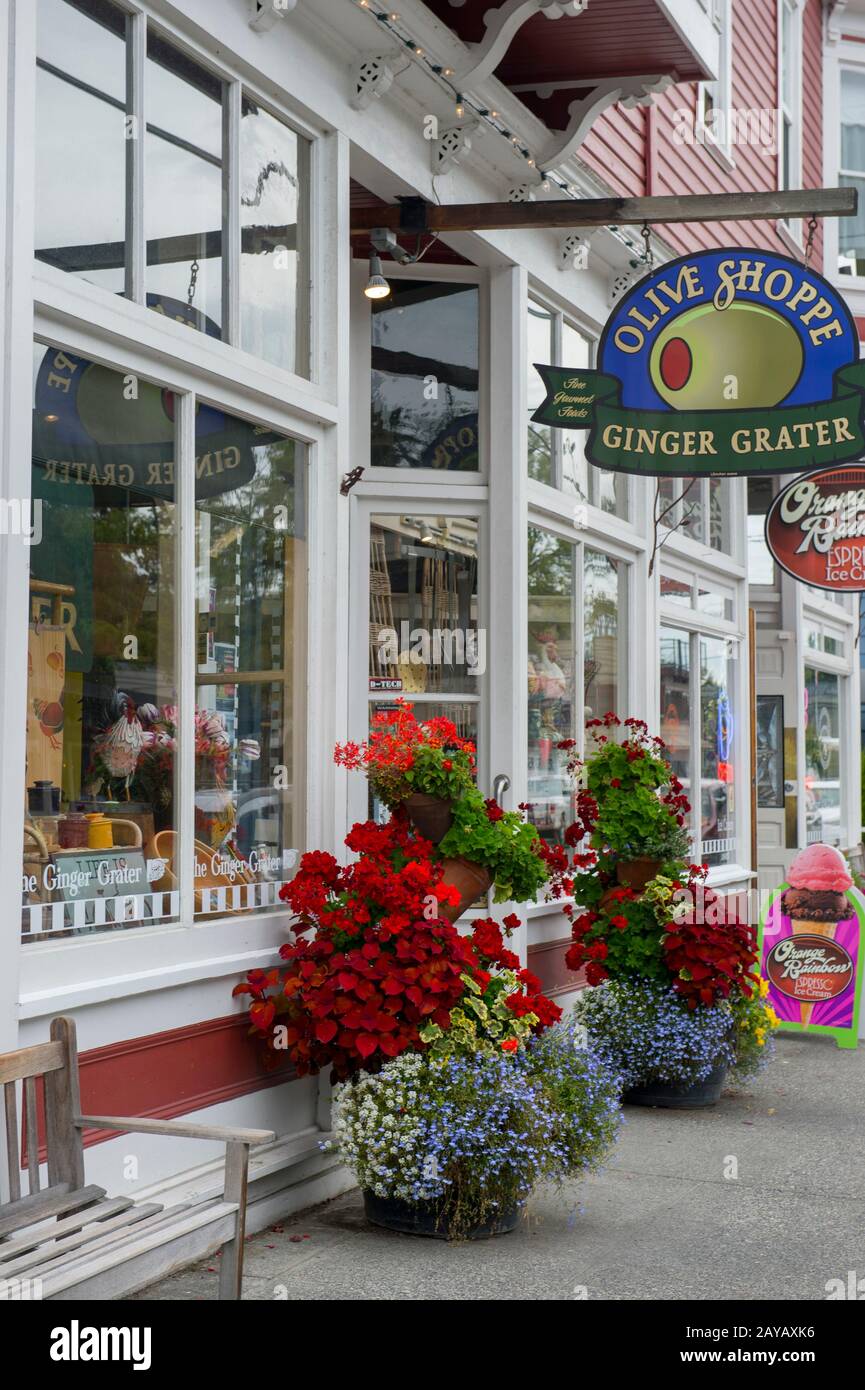 Flower containers in front of shops in the historic town of La Conner in Washington State, United States. Stock Photo