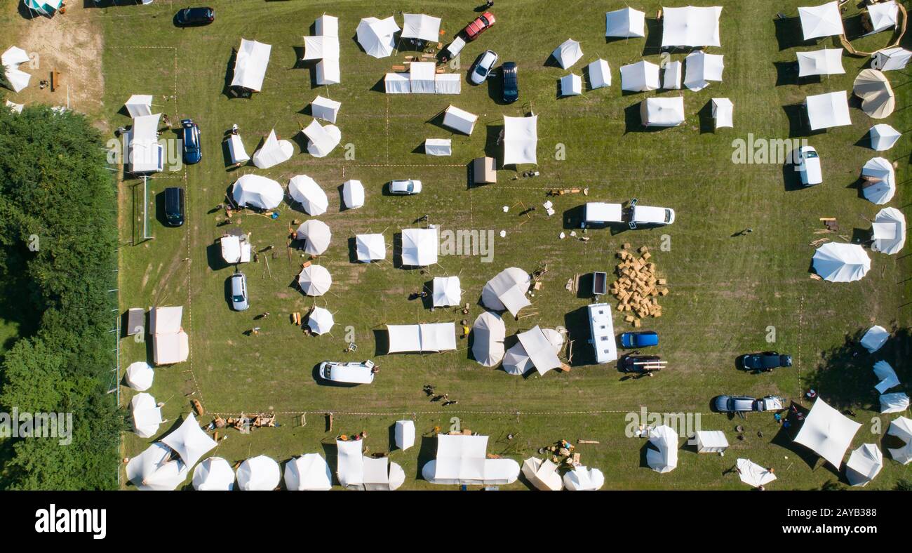 Aerial view of a tent camp and market stalls at a medieval spectacle ...