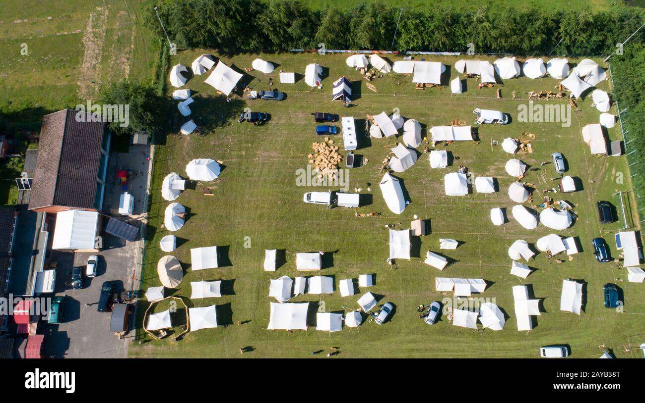 Aerial view of a tent camp and market stalls at a medieval spectacle ...