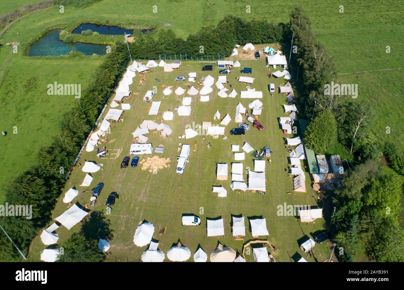 Aerial view of a tent camp and market stalls at a medieval spectacle ...