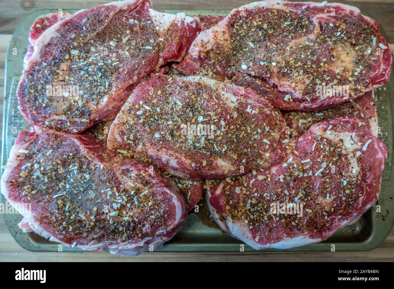 marinated rib eye steaks ready to grill for dinner Stock Photo Alamy