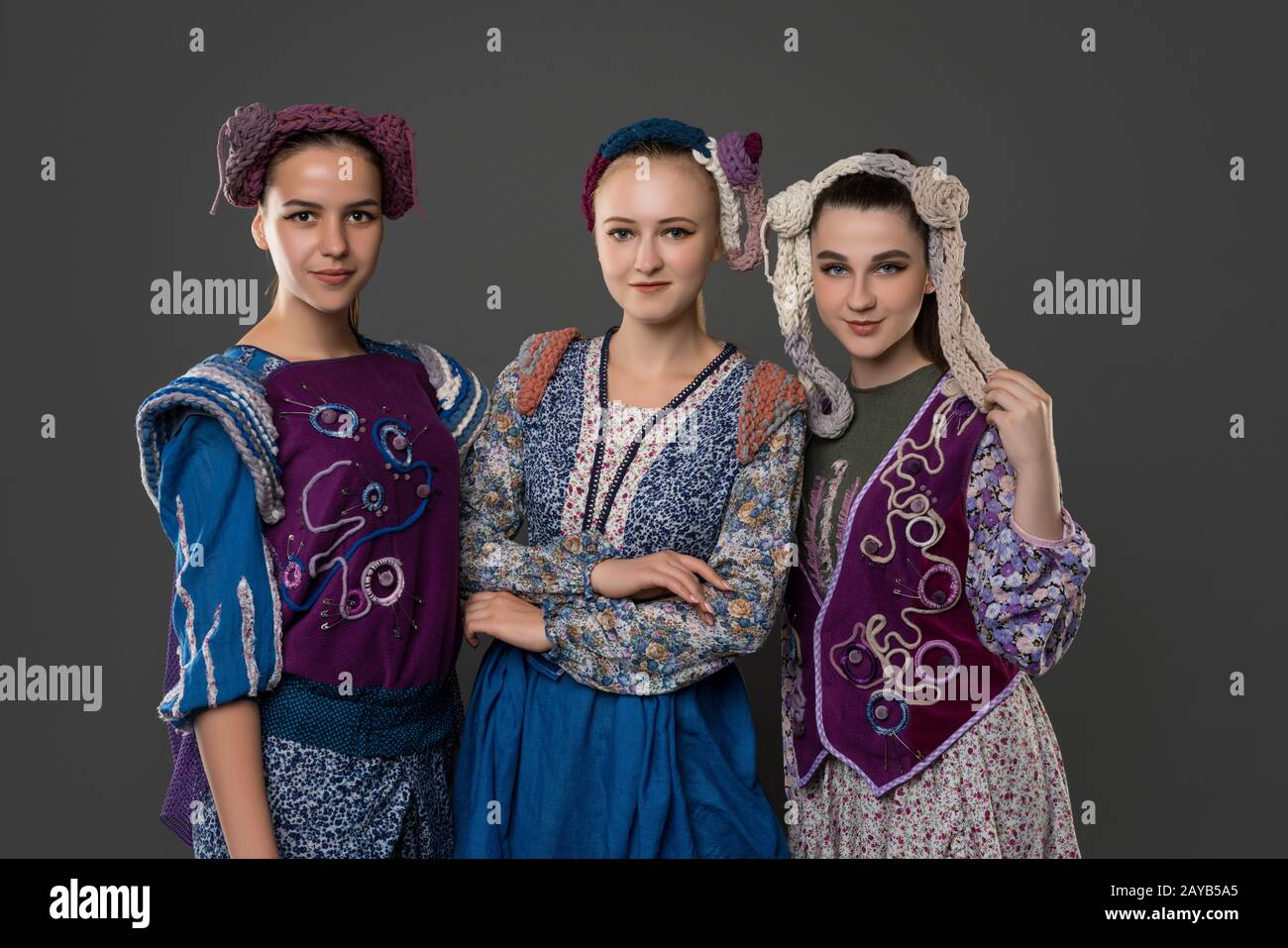 Teenaged girls in original costumes and hats Stock Photo - Alamy