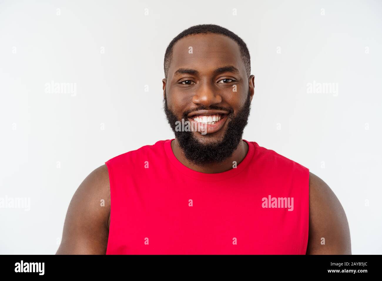 Young fitness african black man in sport wear cheering carefree and