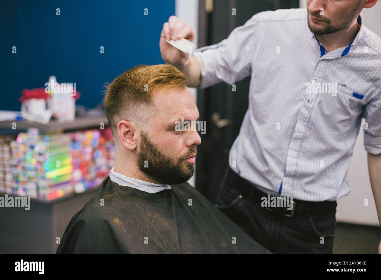 Barber Making Haircut Bearded Man In Professional stylist