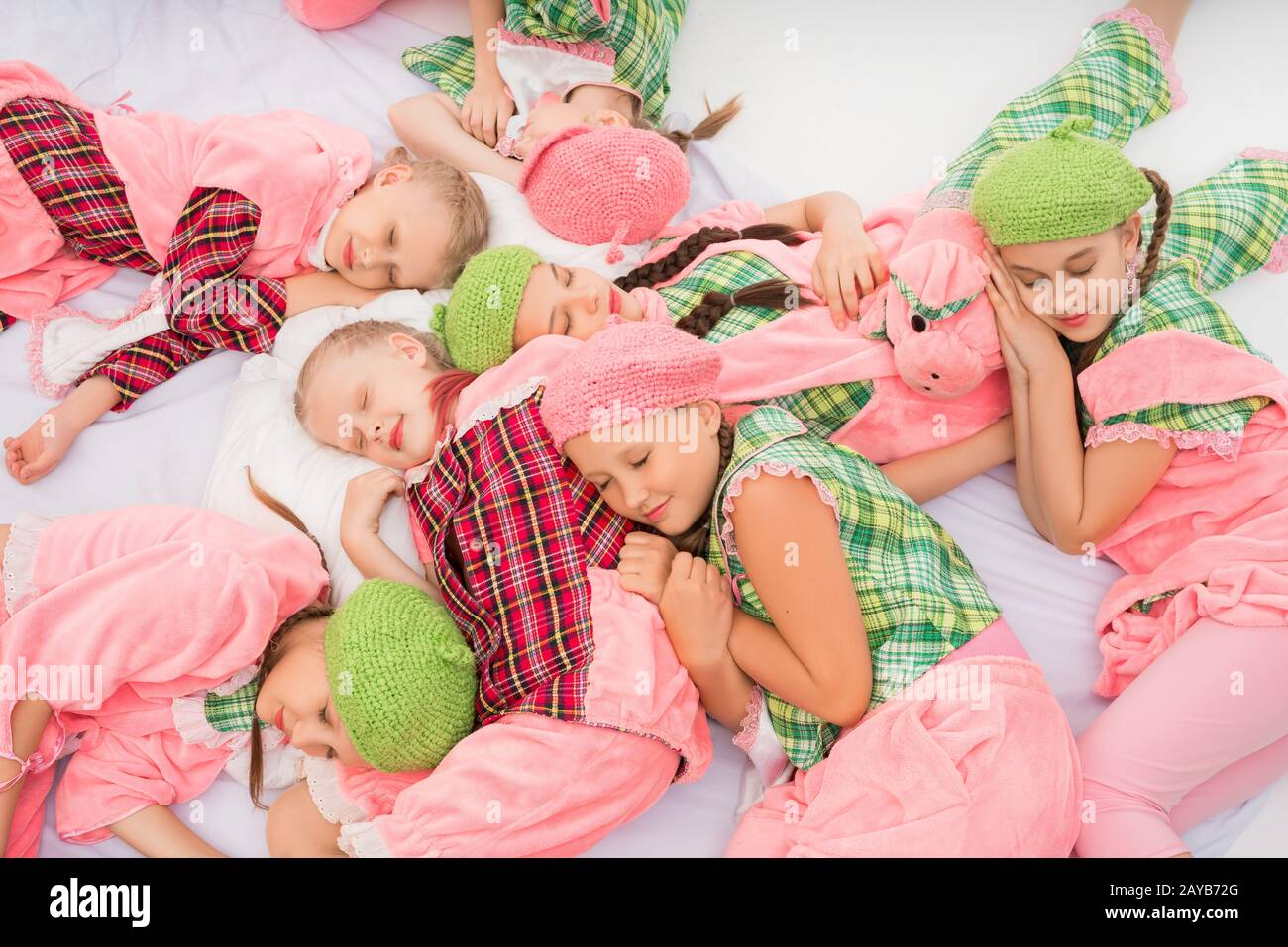 Girls in colorful pajamas sleeping shot Stock Photo - Alamy