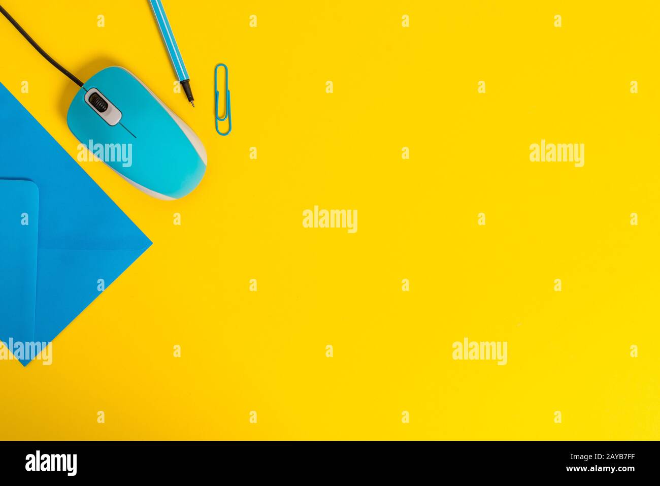 Front view closed envelope clip binder pencil marker computer wire mouse gadget colored background Empty text important events h Stock Photo