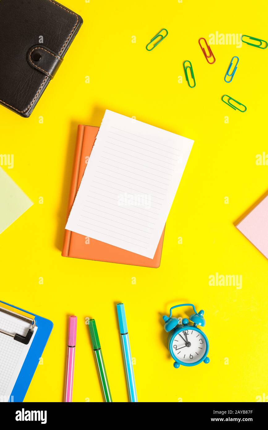Business concept with papers and paper clips. Pile of empty papers with copy space on the table. Paper clips with blank papers f Stock Photo