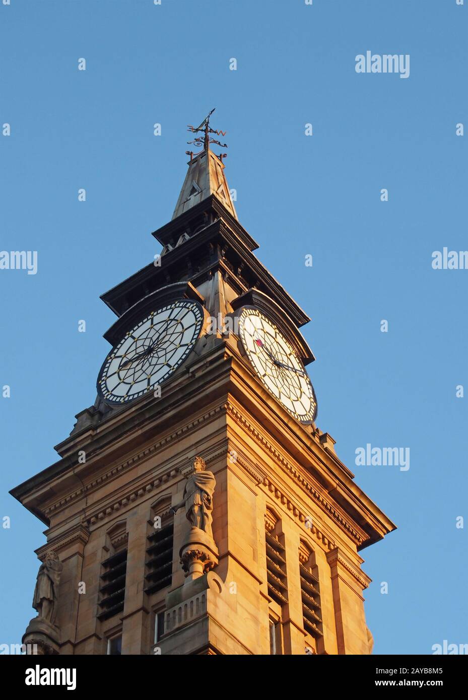 the clock tower of the historic victorian atkinson building in southport merseyside against a blue summer sky Stock Photo