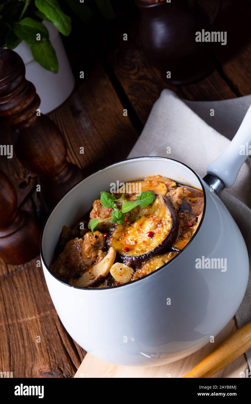 Veal goulash with baked aubergine and herbs Stock Photo - Alamy