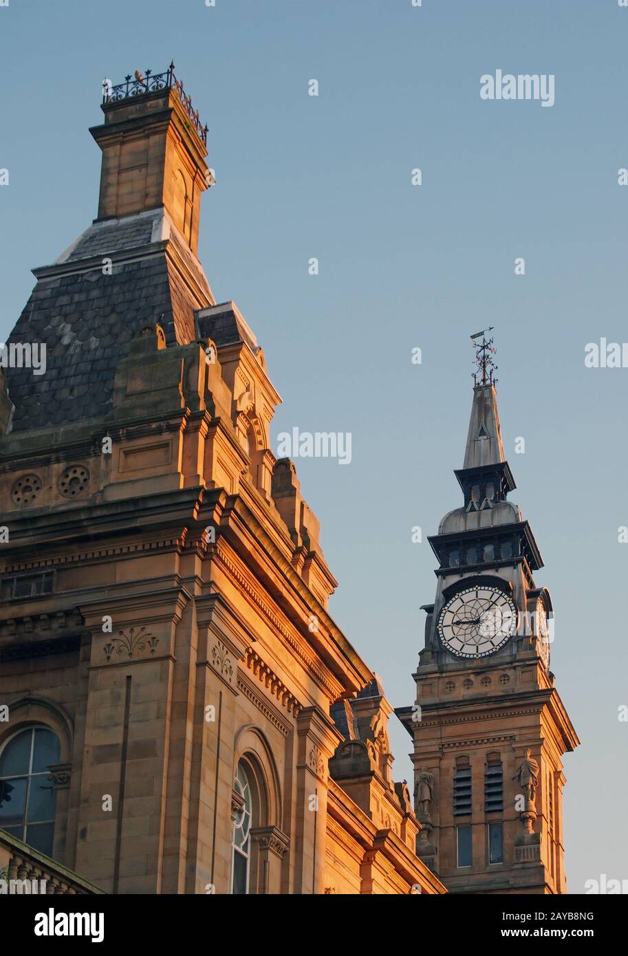 a close up of the roof windows and clock tower of the historic victorian atkinson building in southport merseyside against a blu Stock Photo