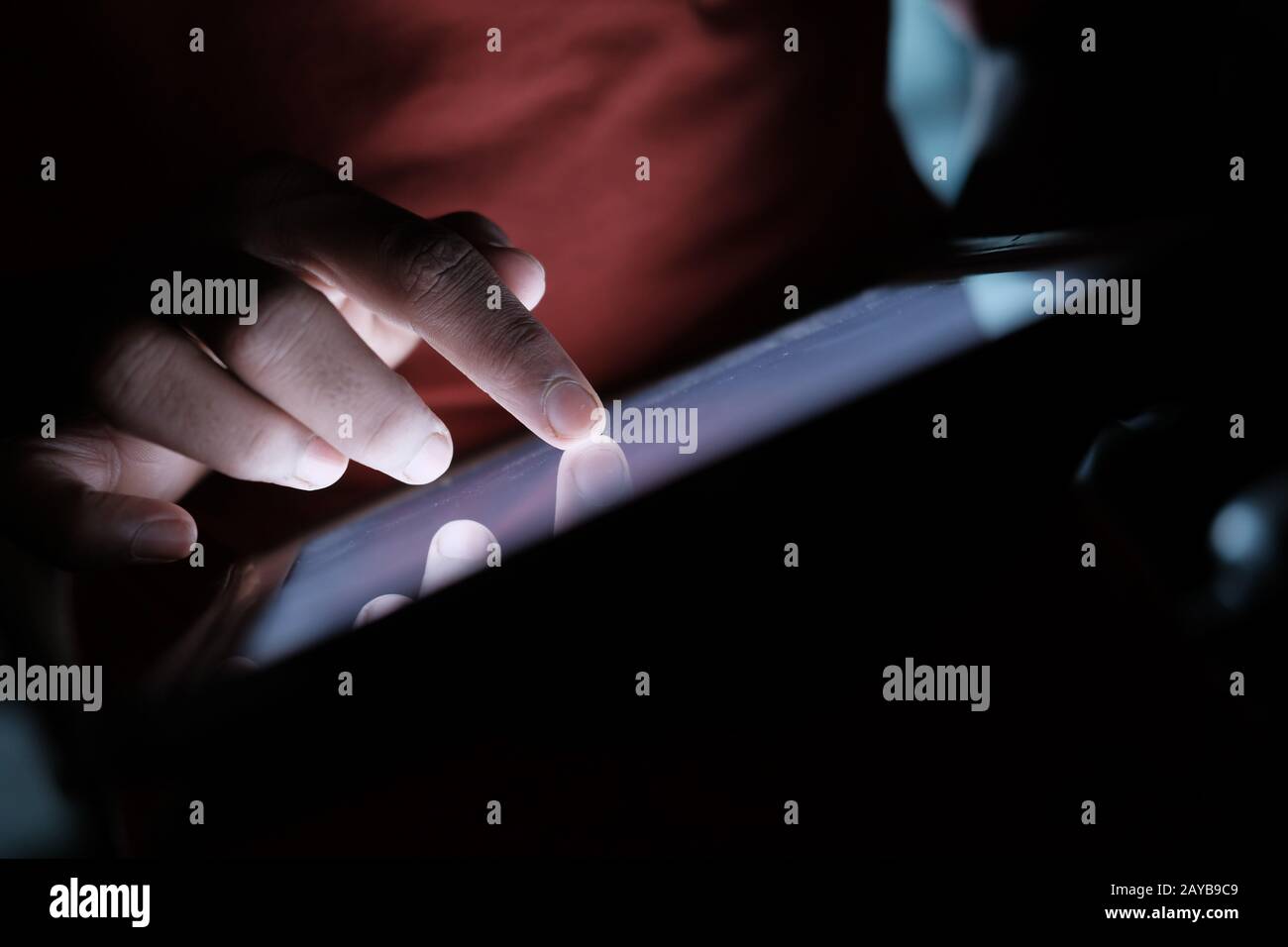 young man use digital tablet at night, close up  Stock Photo