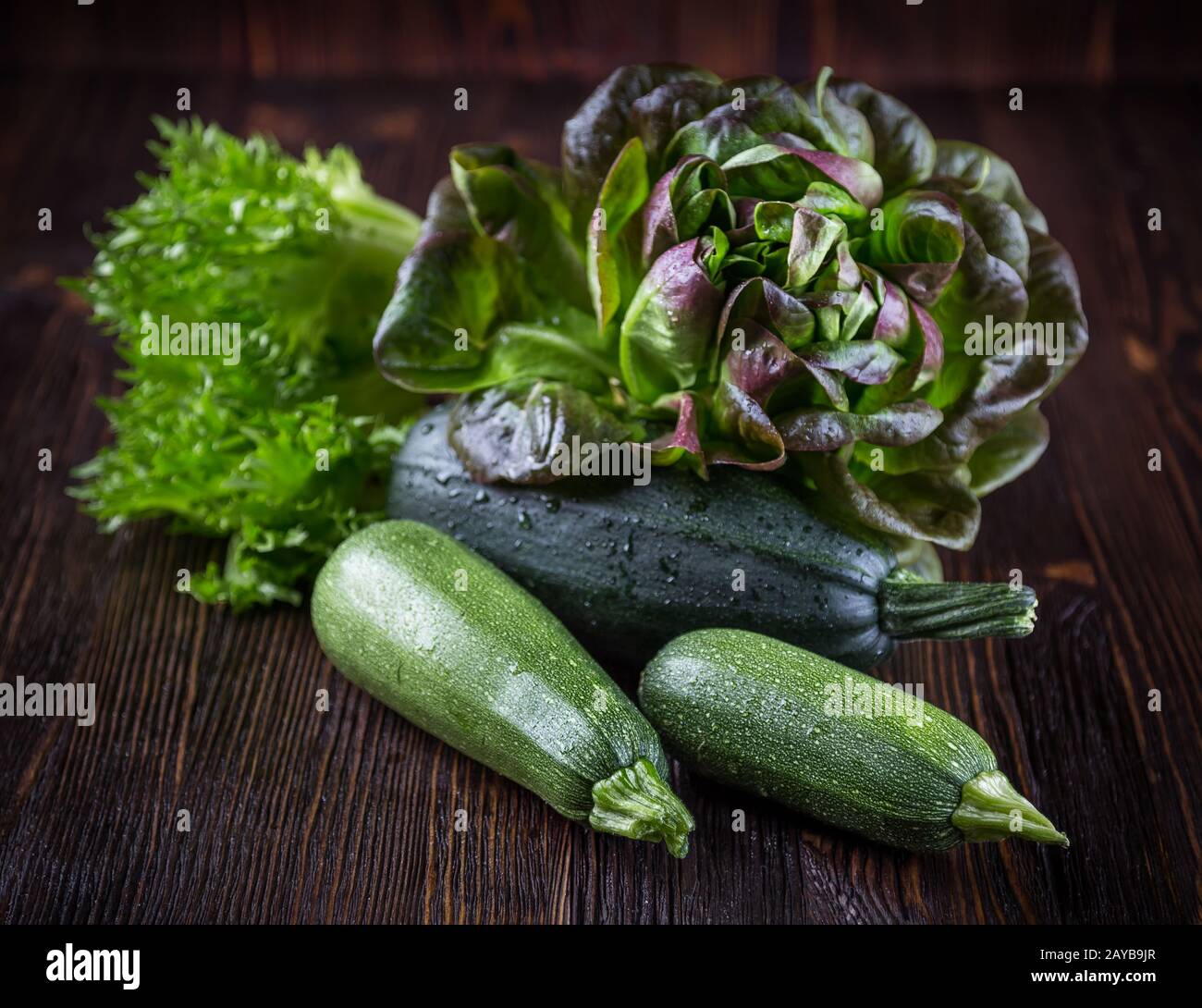 Zucchini with oakleaf lettuce Stock Photo