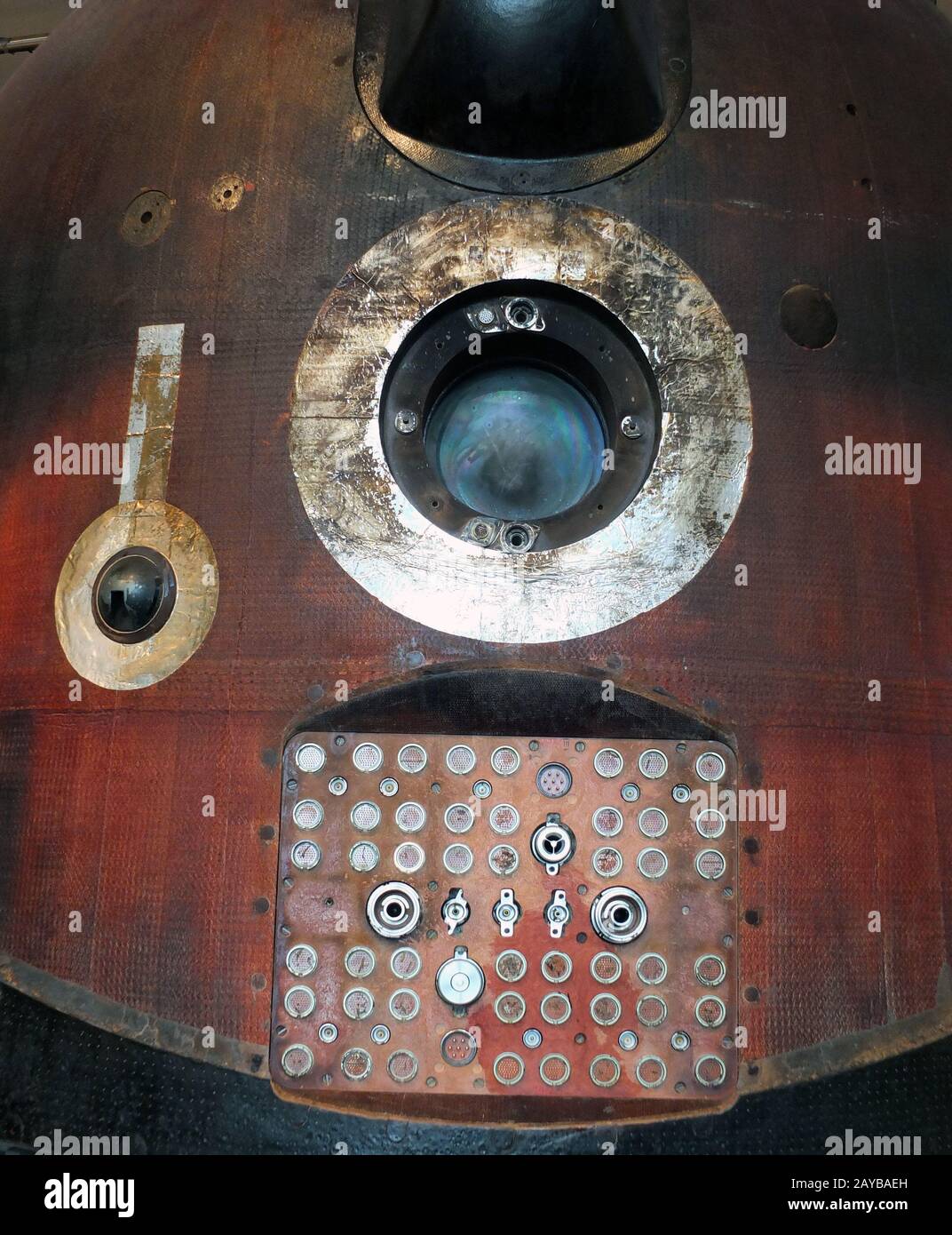 soyuz space capsule window and electrical connecting panel with reentry burns and scorch marks Stock Photo
