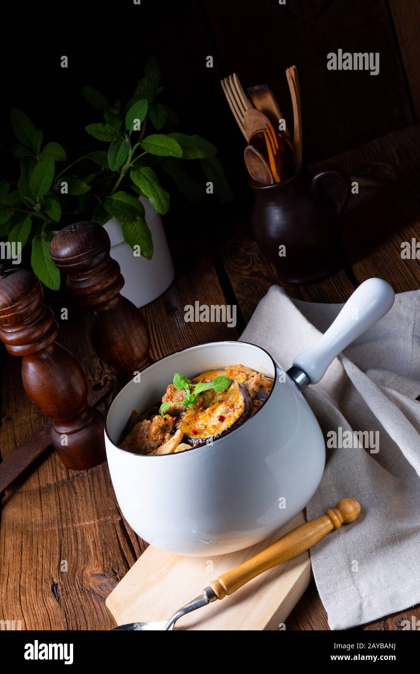 Veal goulash with baked aubergine and herbs Stock Photo - Alamy