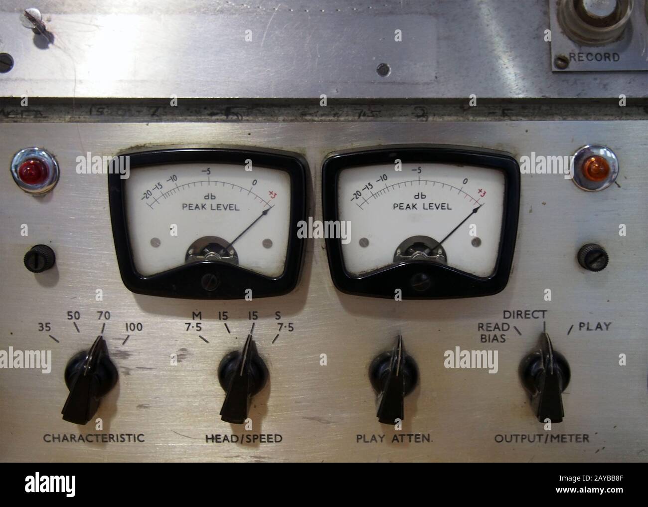 a close up of two old decibel meters on an old vintage reel to reel tape recorder with control knobs and switches Stock Photo