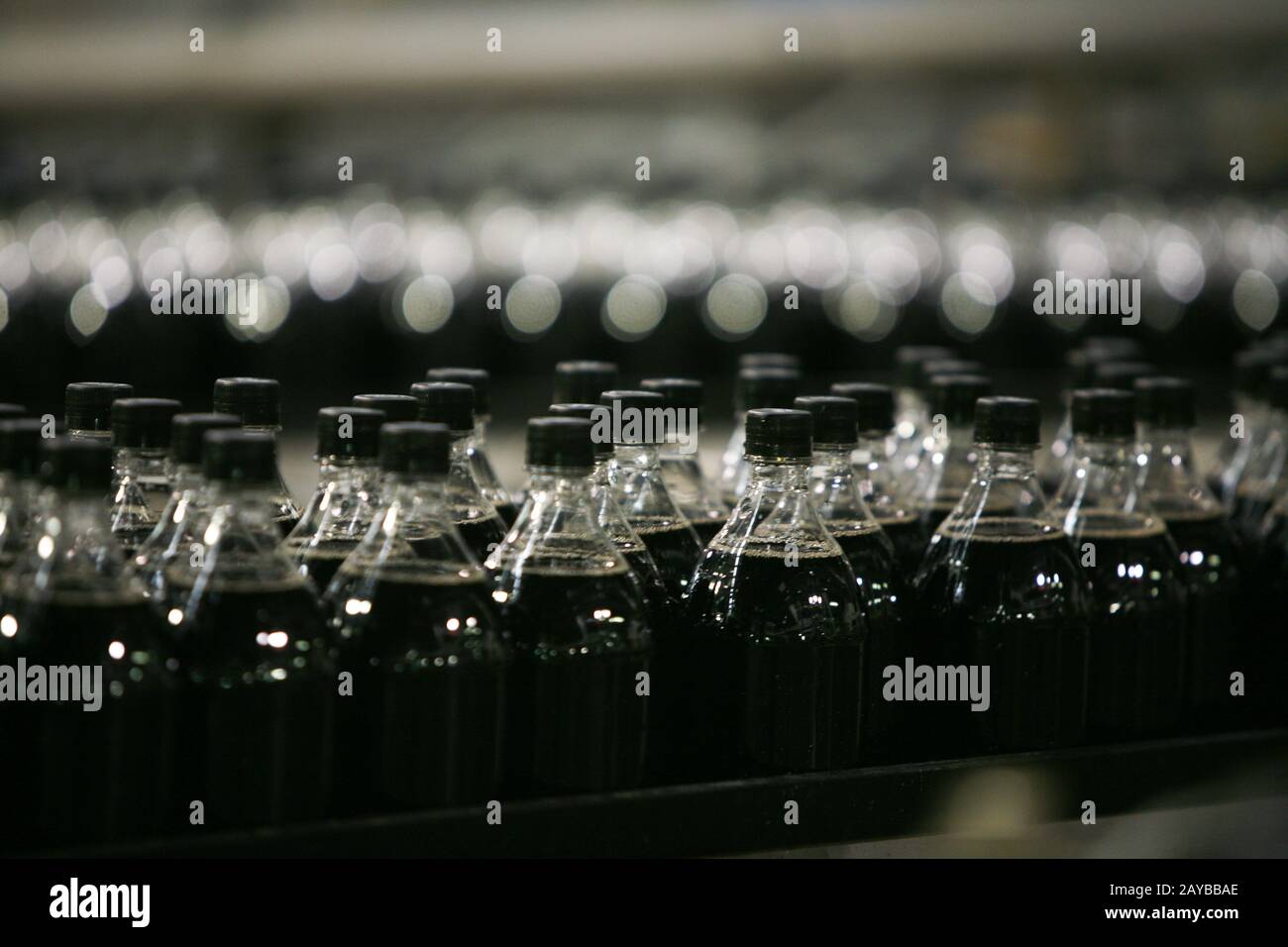 Soft drink bottles are processed at a bottling plant Stock Photo Alamy