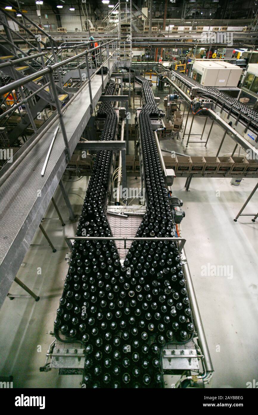 Soft drink bottles are processed at a bottling plant Stock Photo Alamy