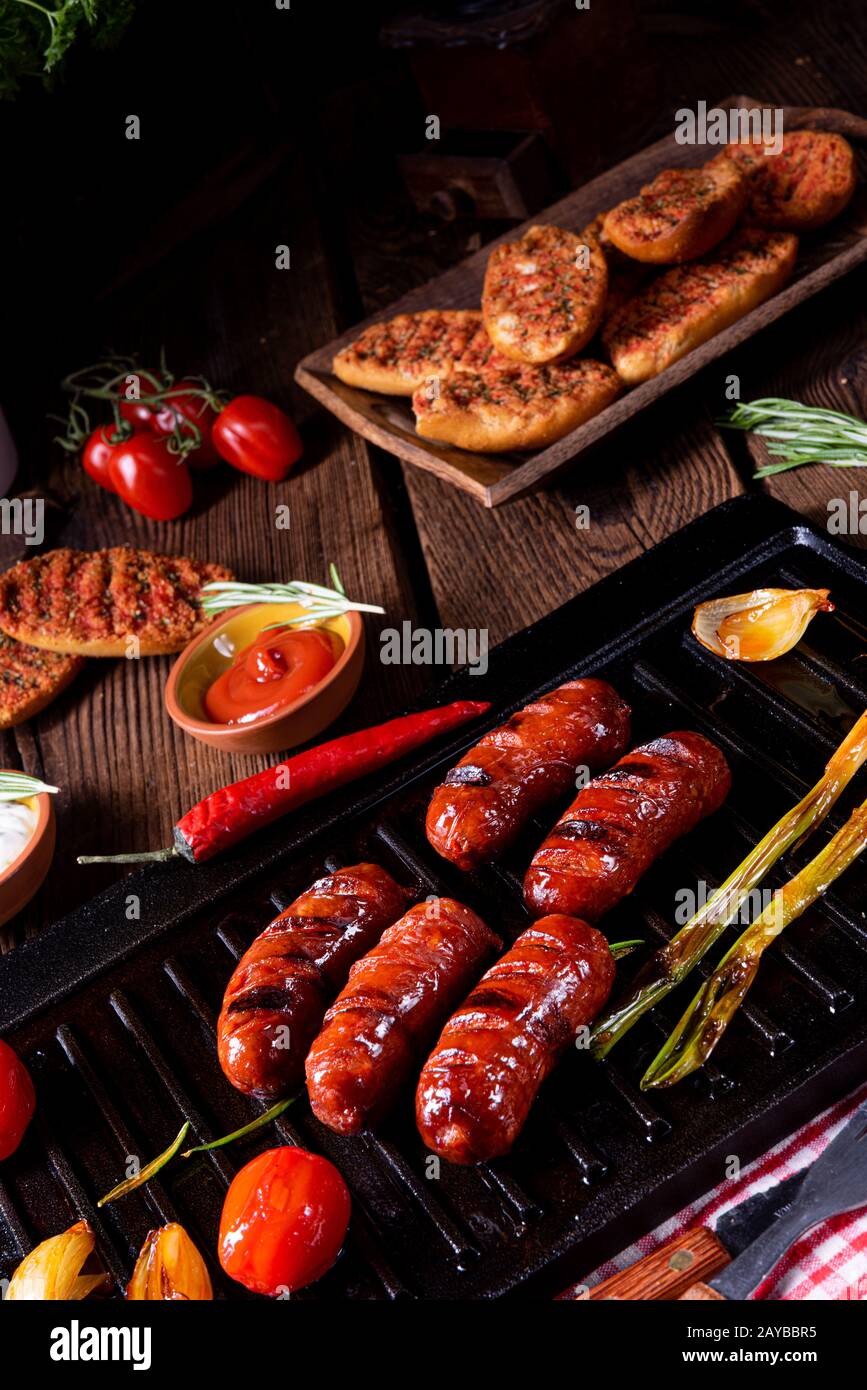 Chili chorizo sausage with tomato bruschetta Stock Photo - Alamy