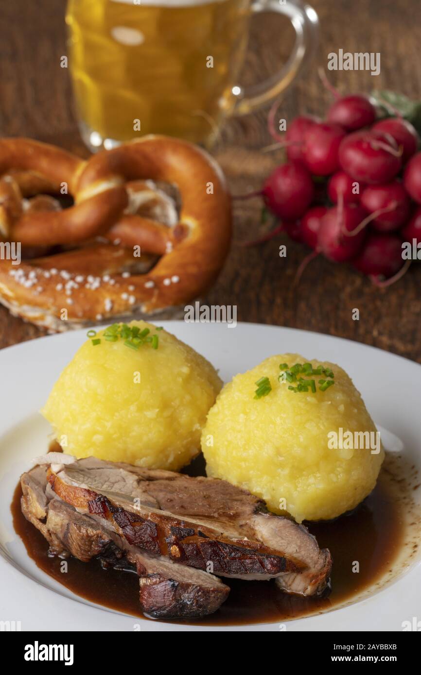 Bavarian roast pork with dumplings Stock Photo Alamy
