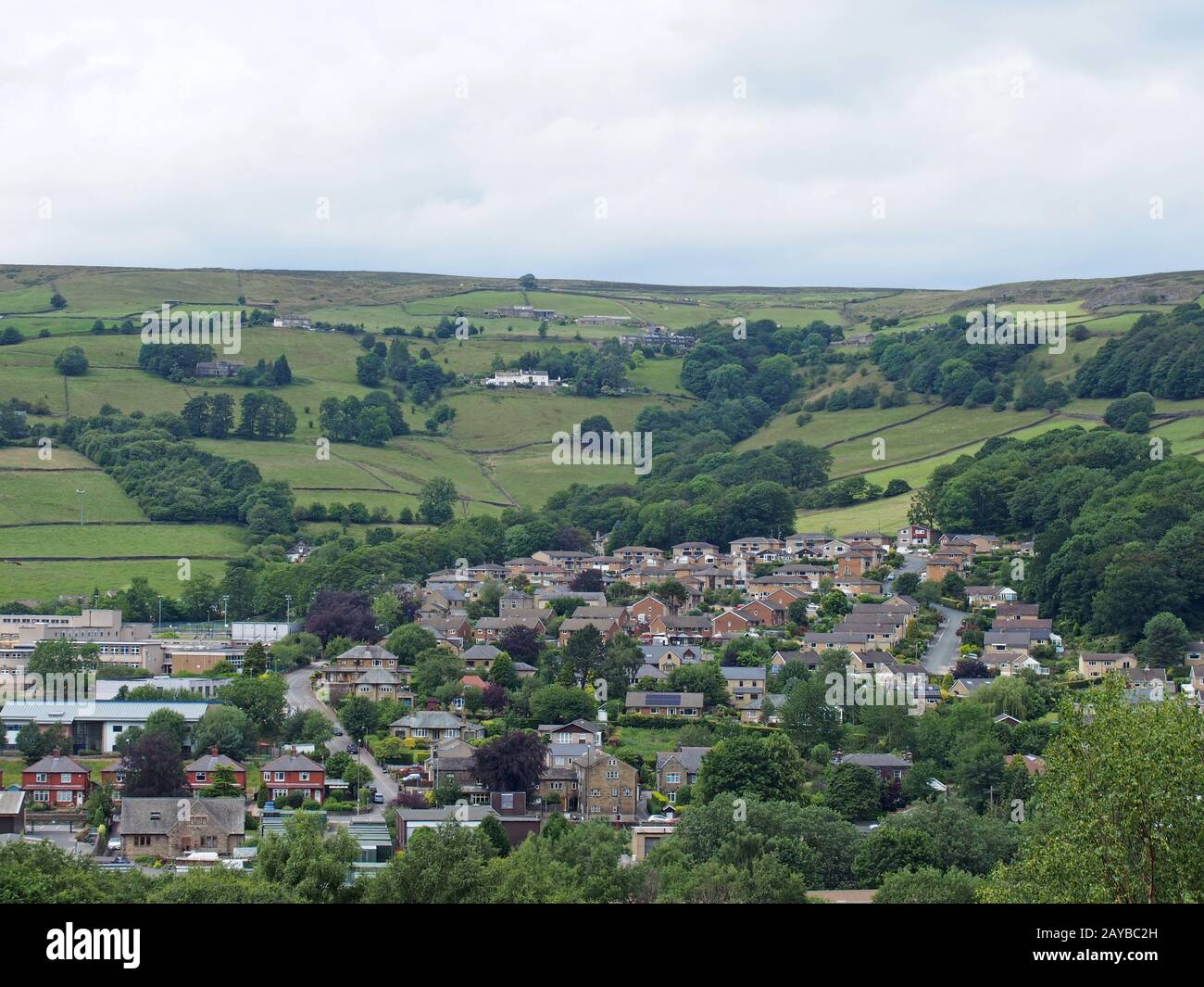 a view of mytholmroyd from above in west yorkshire countryside surrounded  by trees and fields and farms Stock Photo - Alamy