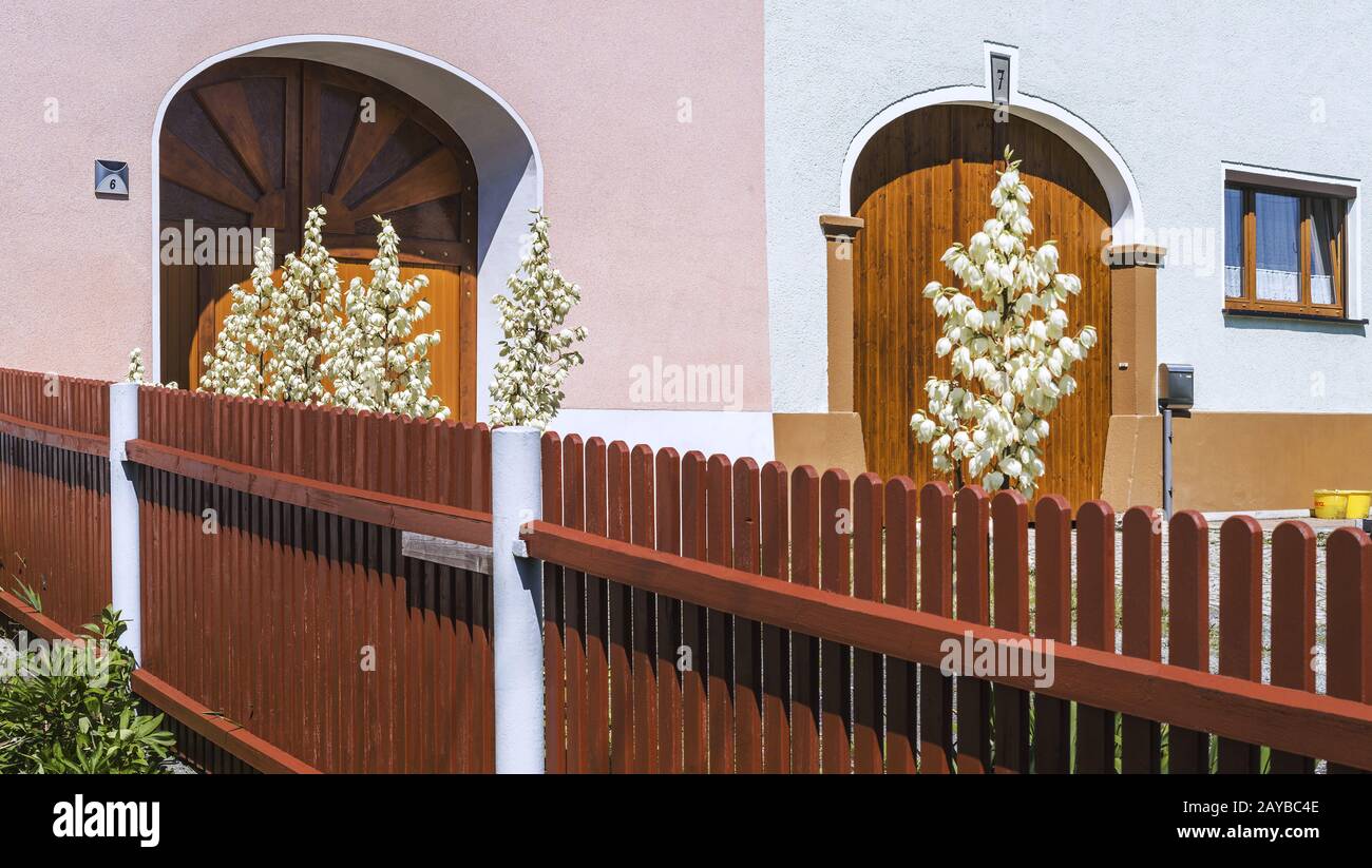 Two house entrances with fence Stock Photo