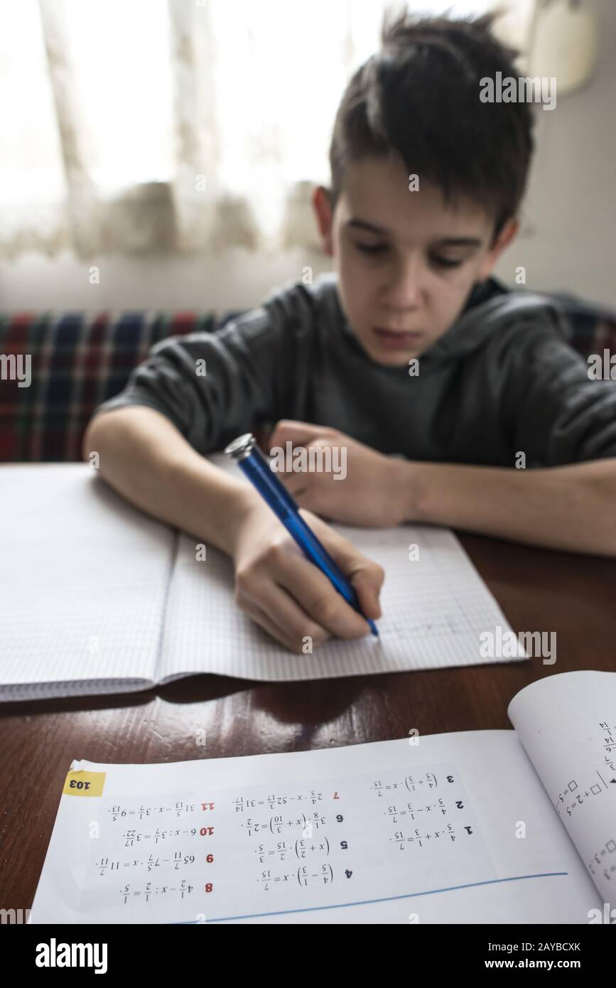Boy do his homework Stock Photo - Alamy