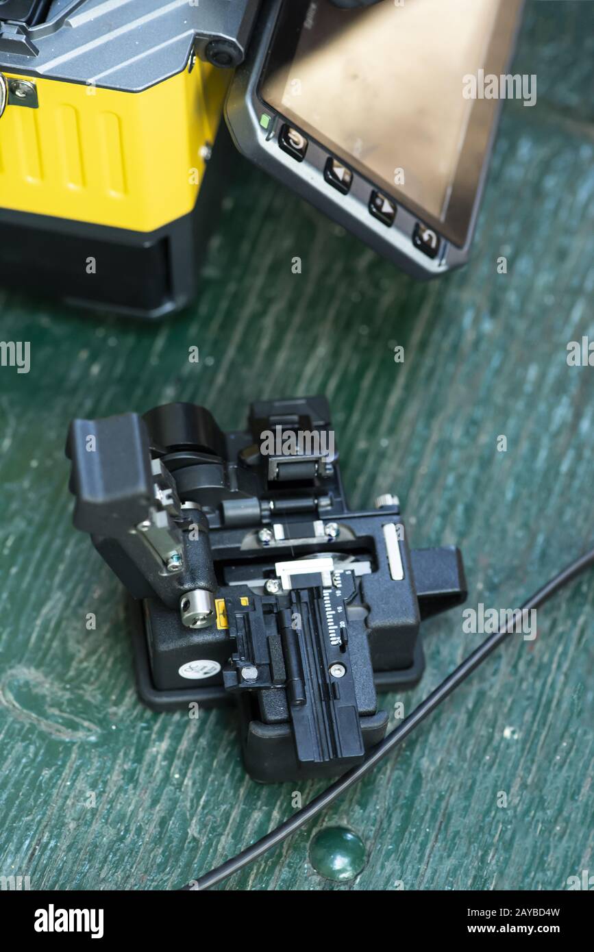 Device for mounting optical cable. Optical internet Technology concept. Stock Photo