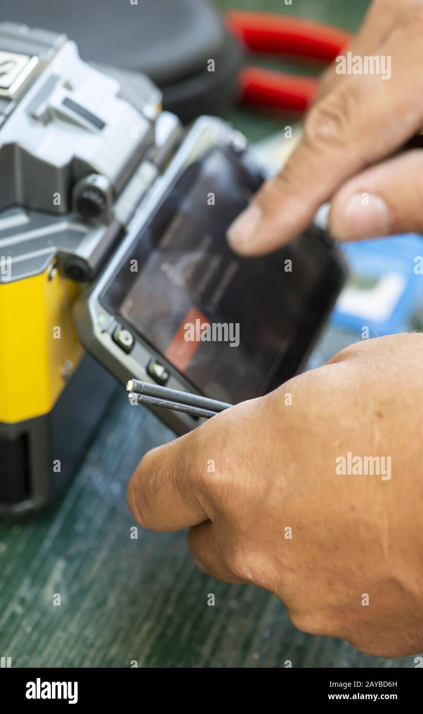 Device for mounting optical cable. Optical internet Technology concept. Stock Photo