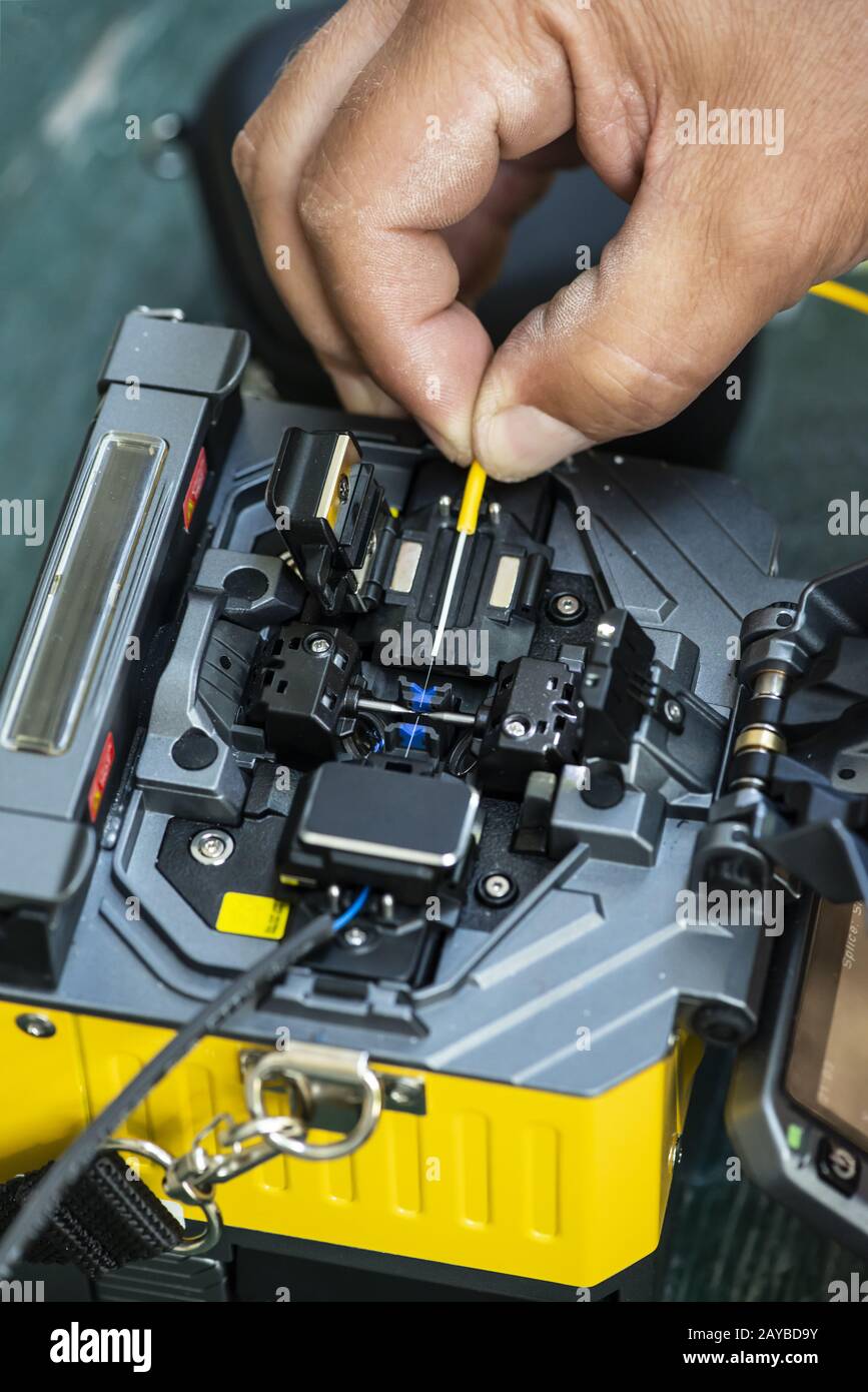 Device for mounting optical cable. Optical internet Technology concept. Stock Photo
