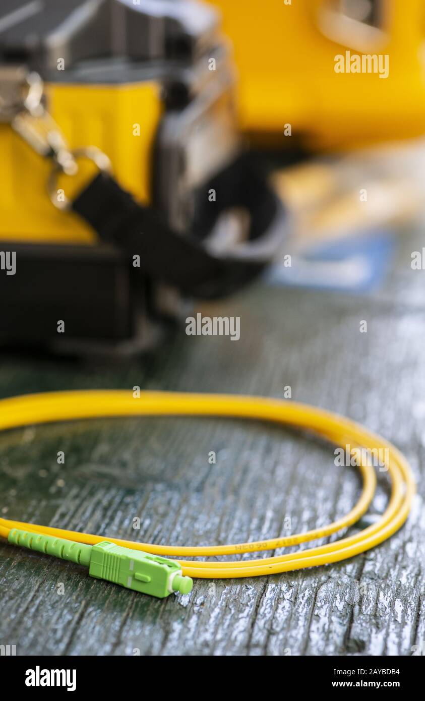 Device for mounting optical cable. Optical internet Technology concept. Stock Photo