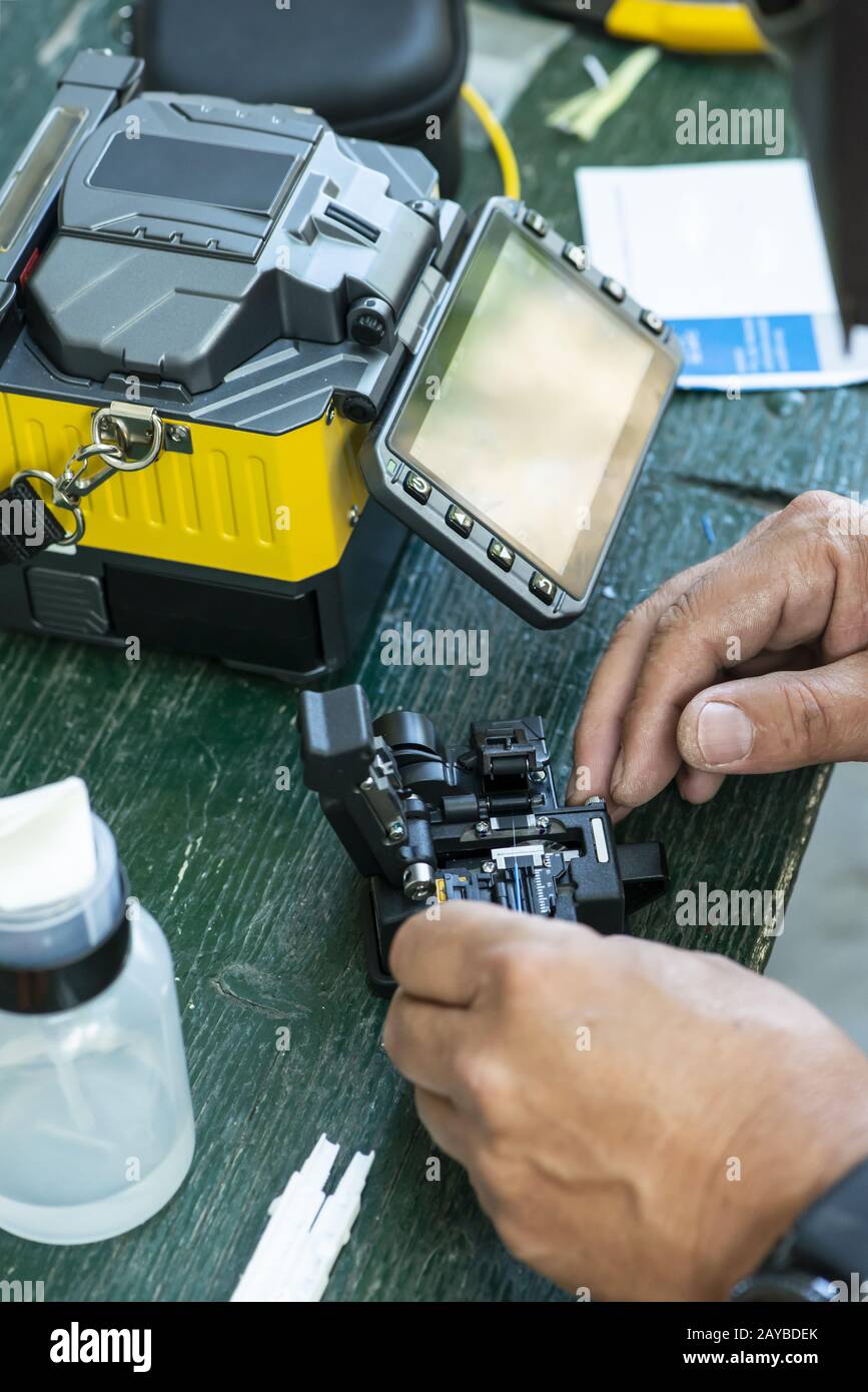 Device for mounting optical cable. Optical internet Technology concept. Stock Photo