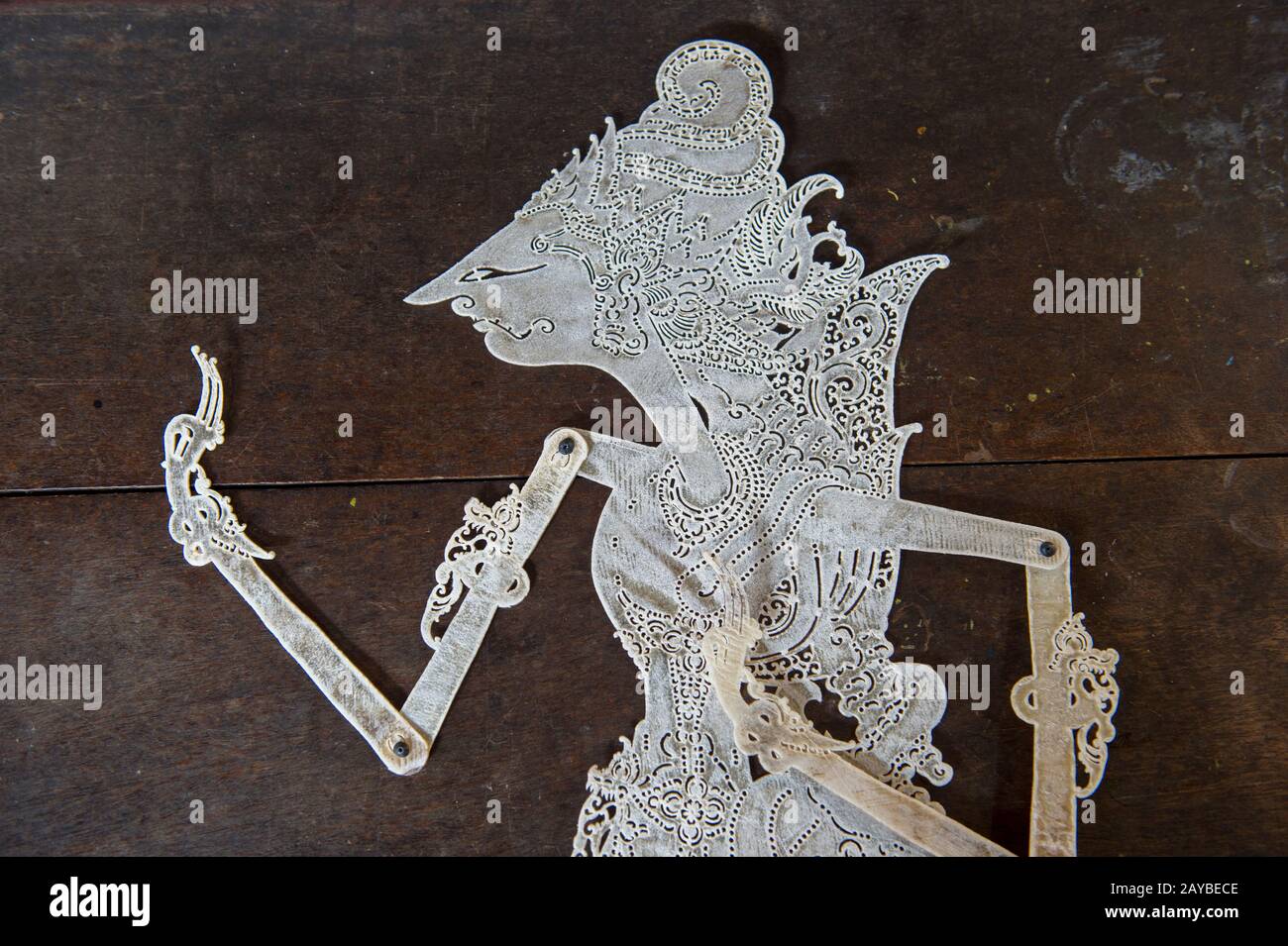 Closeup of an unpainted traditional Javanese wayang kulit (shadow puppet) made out of leather