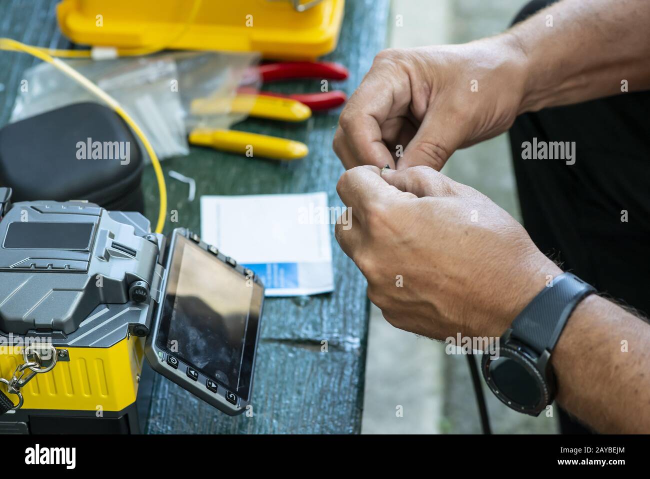 Device for mounting optical cable. Optical internet Technology concept. Stock Photo