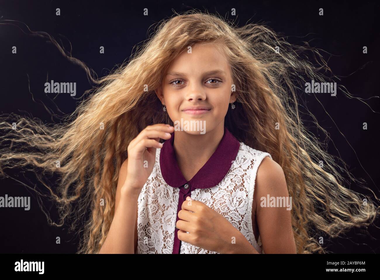 Portrait of a girl with developing hair Stock Photo