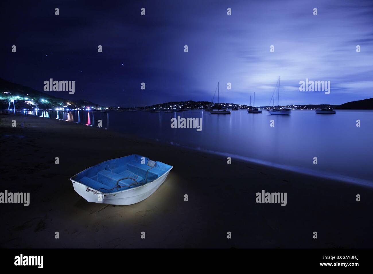 Light painting of A dinghy on the sand Stock Photo