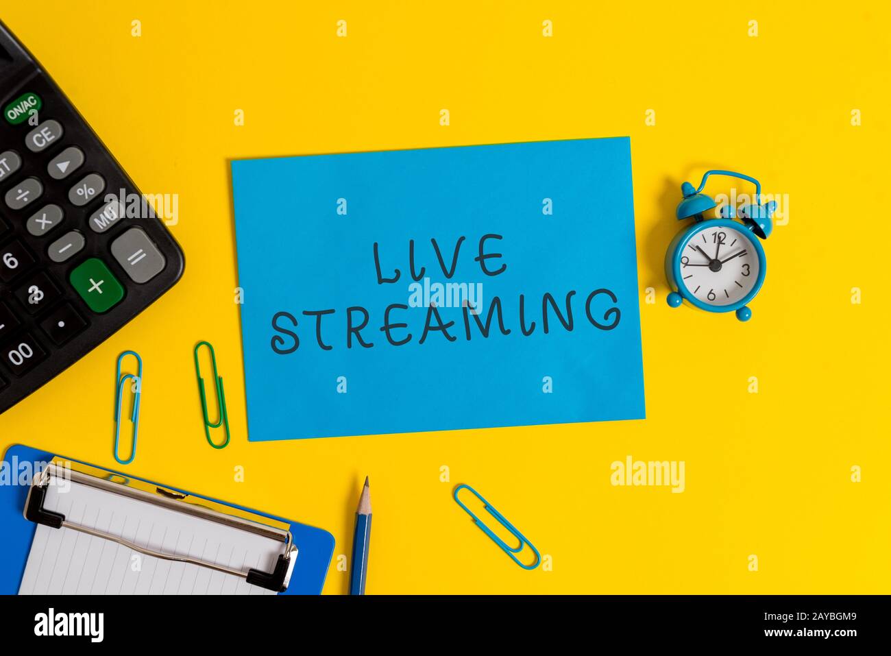Handwriting text Live Streaming. Concept meaning Transmit live video coverage of an event over the Internet Clipboard sheet clip Stock Photo